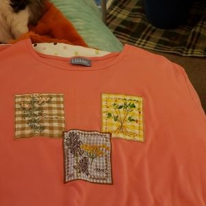 A salmon pink short sleeved shirt 4x